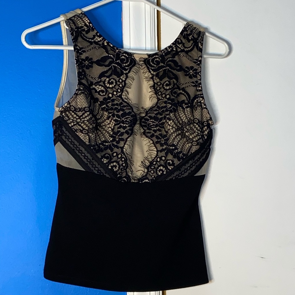 Beige colored shirt with black lace